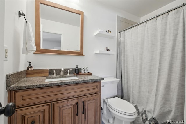 12455 W Alameda Dr, Lakewood, CO 80228 - bathroom featuring toilet and vanity