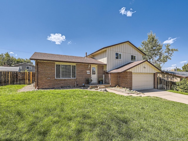 view of front of home featuring a garage and a front lawn