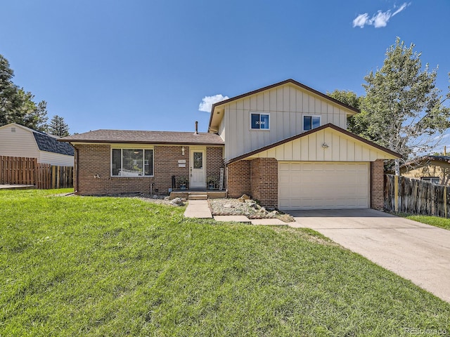 view of front of home featuring a front yard and a garage