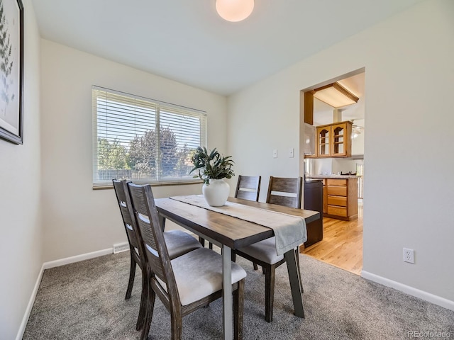 view of carpeted dining space