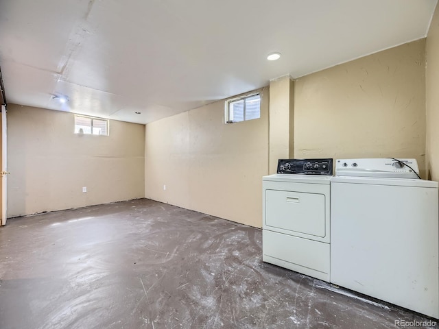 clothes washing area with separate washer and dryer