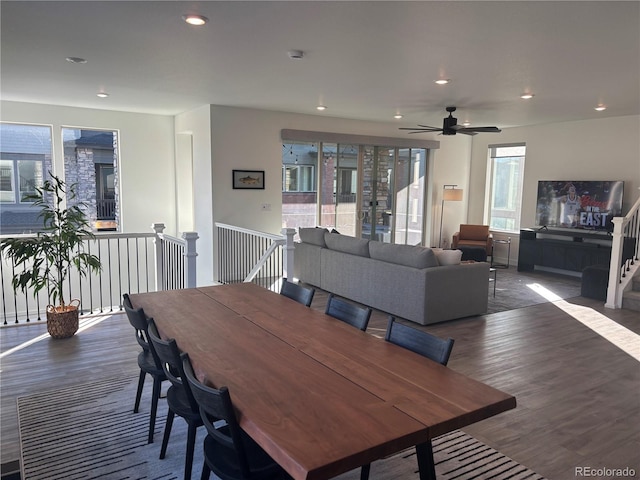 dining space featuring ceiling fan, plenty of natural light, and dark hardwood / wood-style floors