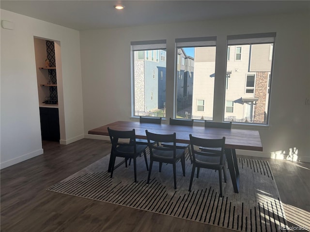 dining room with dark hardwood / wood-style flooring