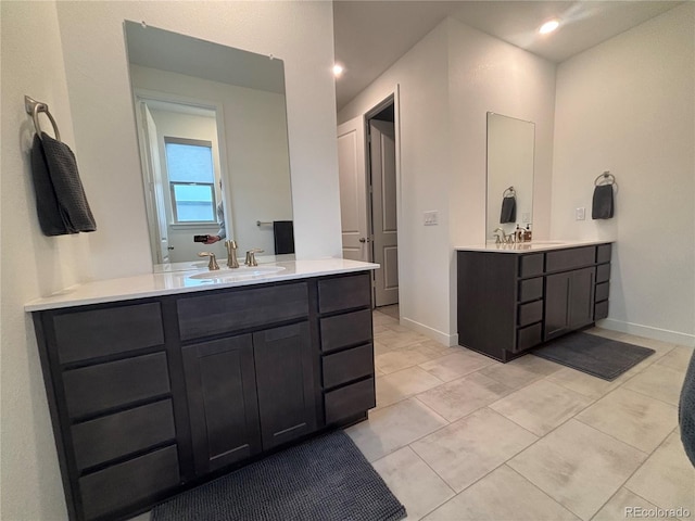 bathroom with tile patterned flooring and vanity