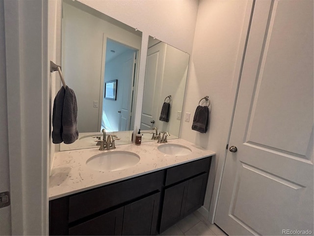15682 W Girard Ave, Morrison, CO 80465 - bathroom with a sink, double vanity, and tile patterned floors