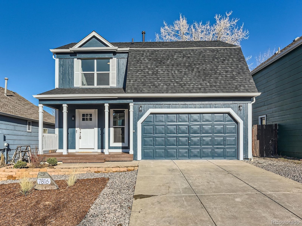 view of front of house featuring covered porch and a garage