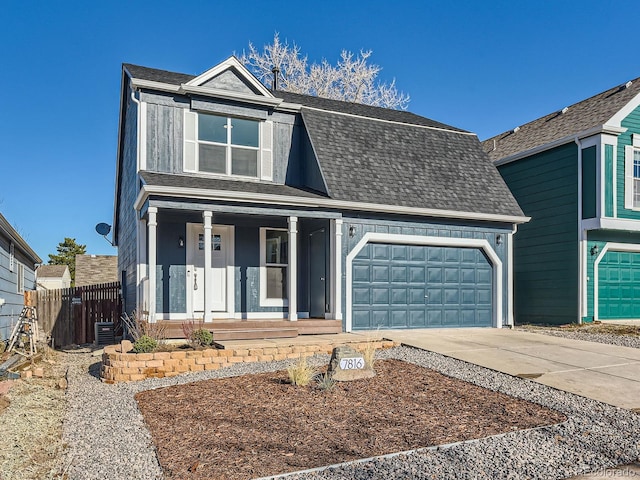 front of property featuring covered porch, central AC, and a garage