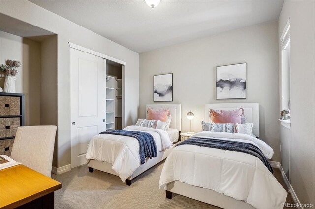 carpeted bedroom featuring a closet