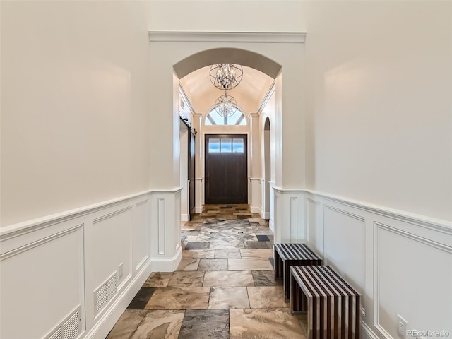 doorway with a chandelier