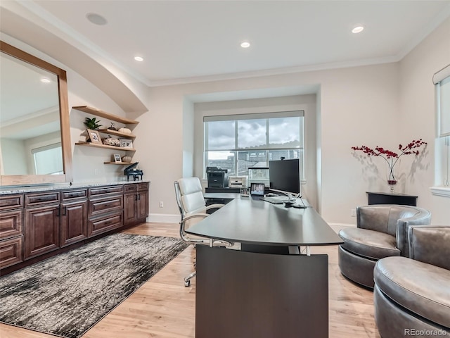 office space featuring crown molding and light hardwood / wood-style floors