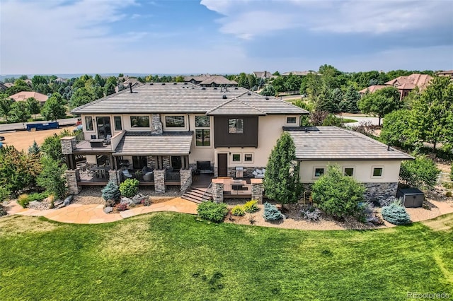 back of house with a yard, an outdoor hangout area, and a deck