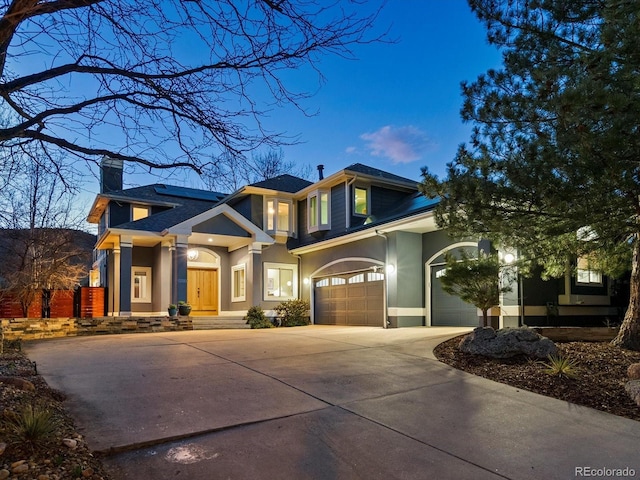 4825 6th St, Boulder, CO 80304 - view of front of home featuring driveway, a chimney, stucco siding, and a garage