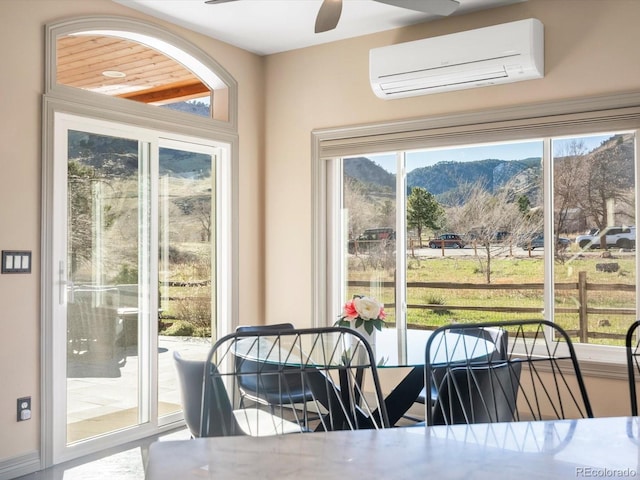 4825 6th St, Boulder, CO 80304 - dining space featuring a mountain view, a ceiling fan, and a wall unit AC