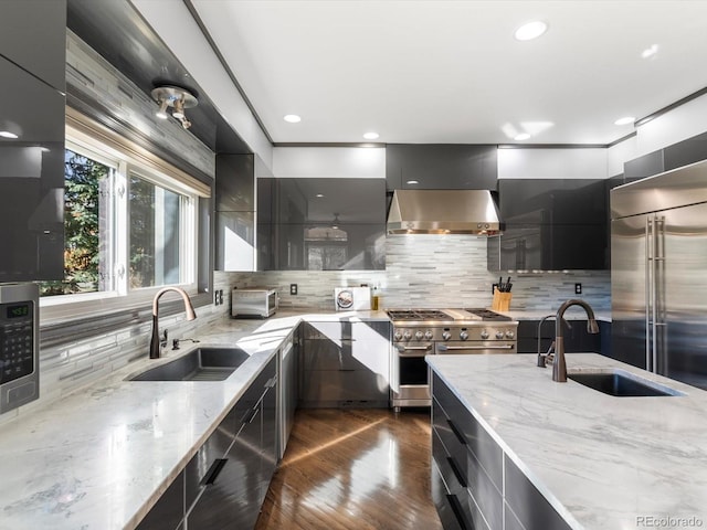 4825 6th St, Boulder, CO 80304 - kitchen with modern cabinets, high end appliances, wall chimney range hood, tasteful backsplash, and recessed lighting