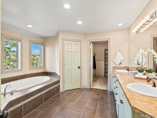 4825 6th St, Boulder, CO 80304 - bathroom featuring double vanity, a garden tub, recessed lighting, and a spacious closet