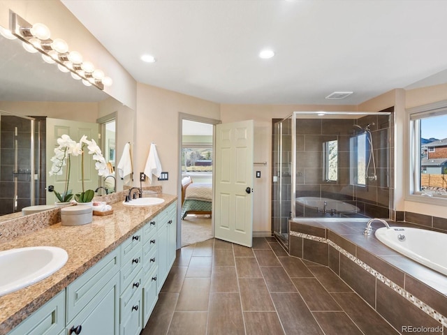 4825 6th St, Boulder, CO 80304 - ensuite bathroom with double vanity, a bath, a shower stall, recessed lighting, and tile patterned flooring
