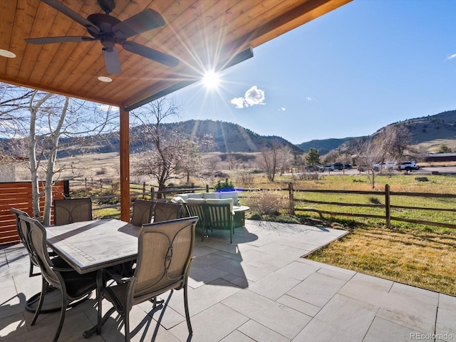 4825 6th St, Boulder, CO 80304 - view of patio / terrace featuring outdoor dining space, a mountain view, and a ceiling fan