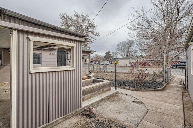 view of side of home with fence