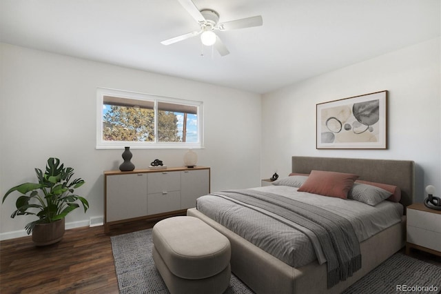 bedroom with ceiling fan, dark wood finished floors, visible vents, and baseboards