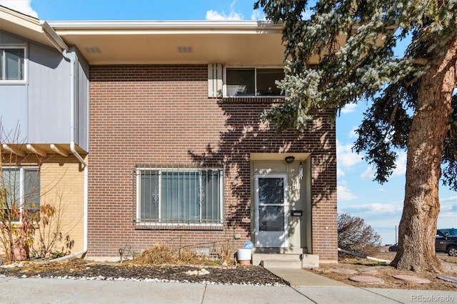 view of front of property featuring brick siding