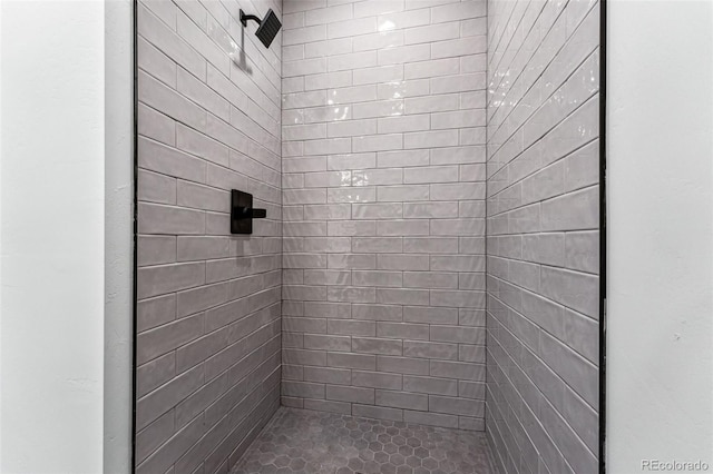 bathroom with tiled shower