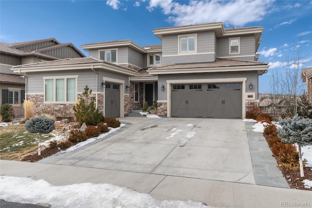 prairie-style house featuring a garage