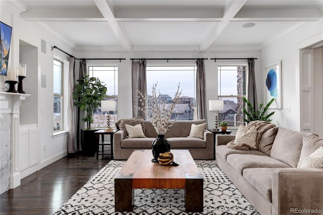 living room with beam ceiling, plenty of natural light, and coffered ceiling