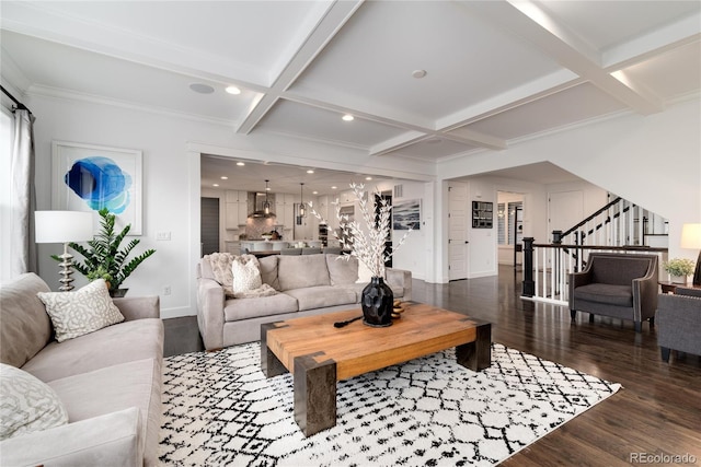 living room featuring beam ceiling, dark hardwood / wood-style floors, coffered ceiling, and ornamental molding