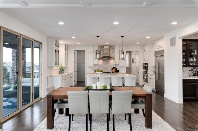 dining space featuring dark wood-type flooring