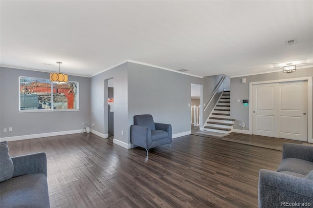 living room featuring dark wood-type flooring and ornamental molding