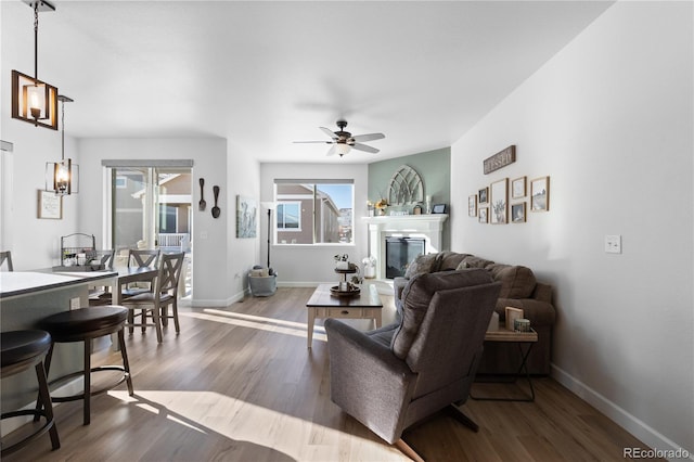 living room featuring hardwood / wood-style flooring and ceiling fan