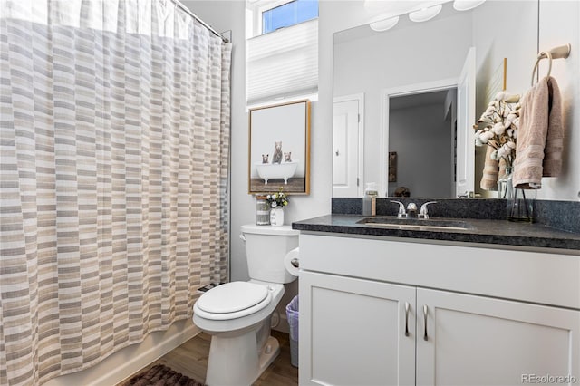 full bathroom featuring shower / bath combination with curtain, vanity, toilet, and wood-type flooring