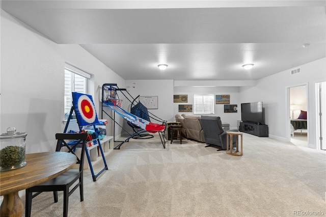 recreation room featuring light carpet