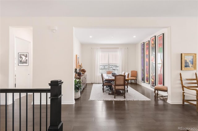 dining area featuring recessed lighting, baseboards, and dark wood-type flooring