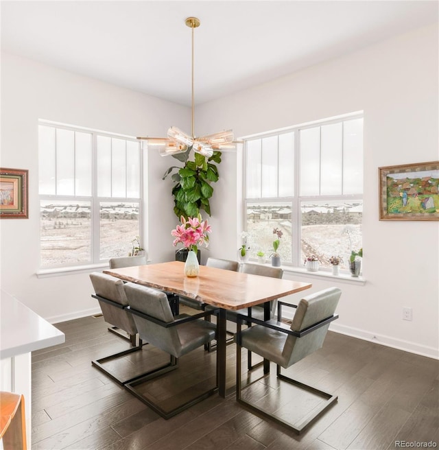 dining area with dark wood-style floors and baseboards