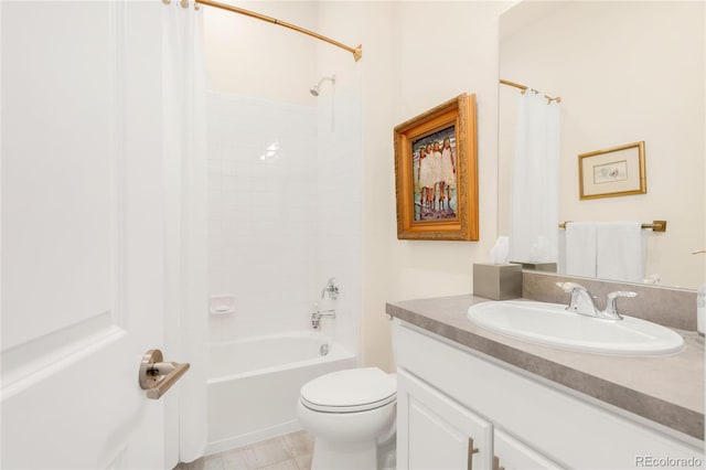 bathroom featuring toilet, shower / tub combo with curtain, and vanity