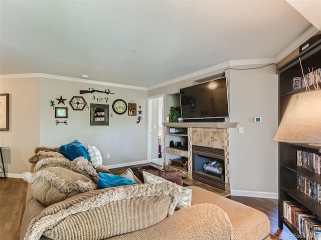 living room featuring dark hardwood / wood-style floors, a premium fireplace, and crown molding