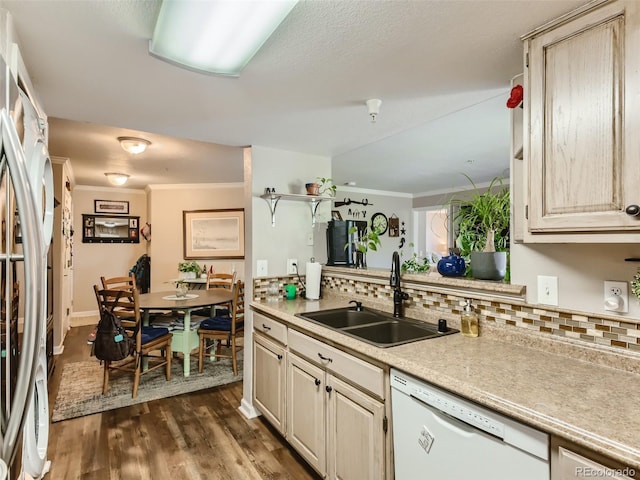 kitchen with white appliances, dark hardwood / wood-style floors, backsplash, and sink