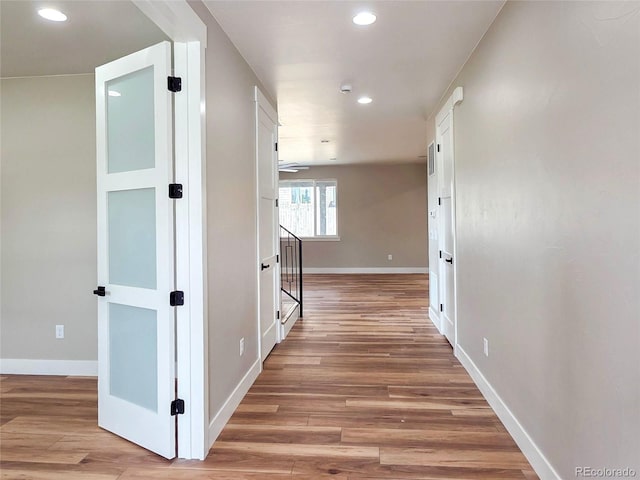 5550 Wetlands Dr, Longmont, CO 80504 - corridor featuring light wood-type flooring and recessed lighting