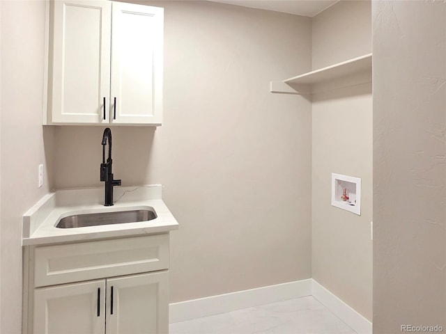 5550 Wetlands Dr, Longmont, CO 80504 - laundry area featuring washer hookup, cabinet space, and marble finish flooring