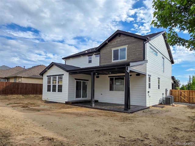 5550 Wetlands Dr, Longmont, CO 80504 - back of property featuring a patio area and a fenced backyard