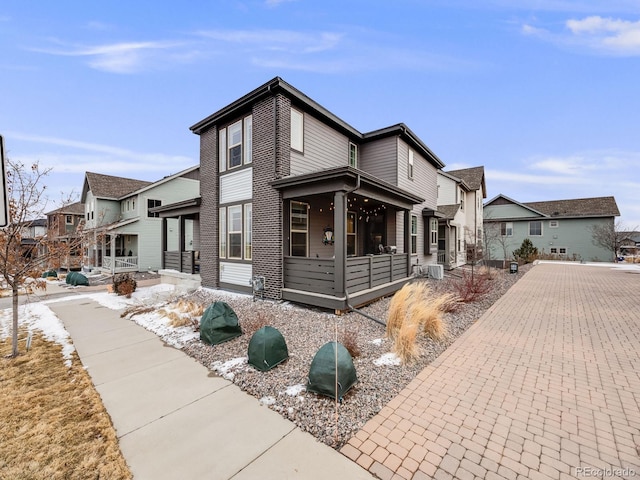 view of front of home featuring a residential view and covered porch