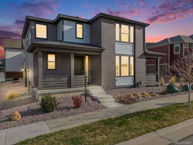 view of front of house with brick siding