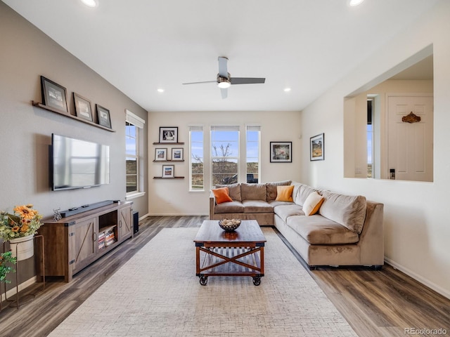 living room with wood finished floors, ceiling fan, baseboards, and recessed lighting