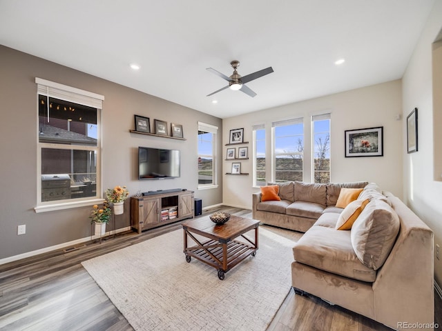 living area featuring ceiling fan, recessed lighting, wood finished floors, and baseboards