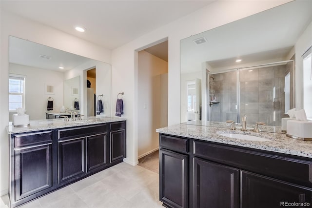 bathroom featuring vanity, tile patterned flooring, visible vents, recessed lighting, and a stall shower