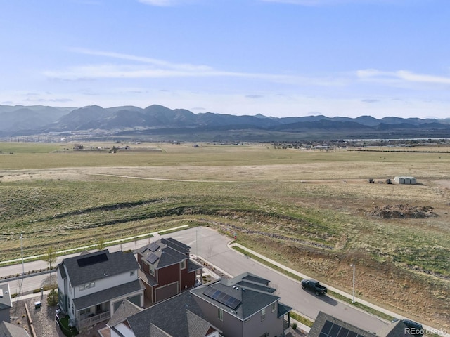 aerial view with a mountain view and a rural view