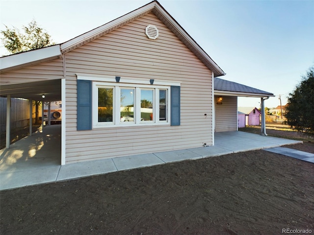 view of side of home featuring a carport