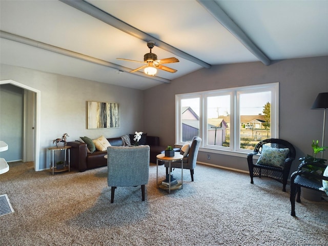 carpeted living room with lofted ceiling with beams and ceiling fan