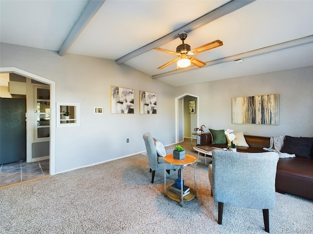 living room featuring vaulted ceiling with beams, carpet, and ceiling fan